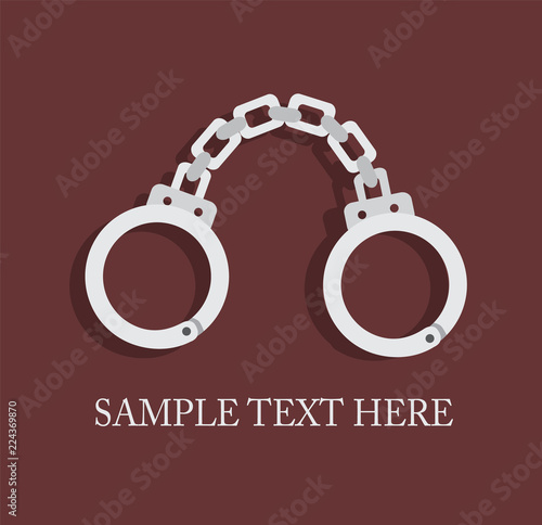 fresh metal handcuffs on a dark background