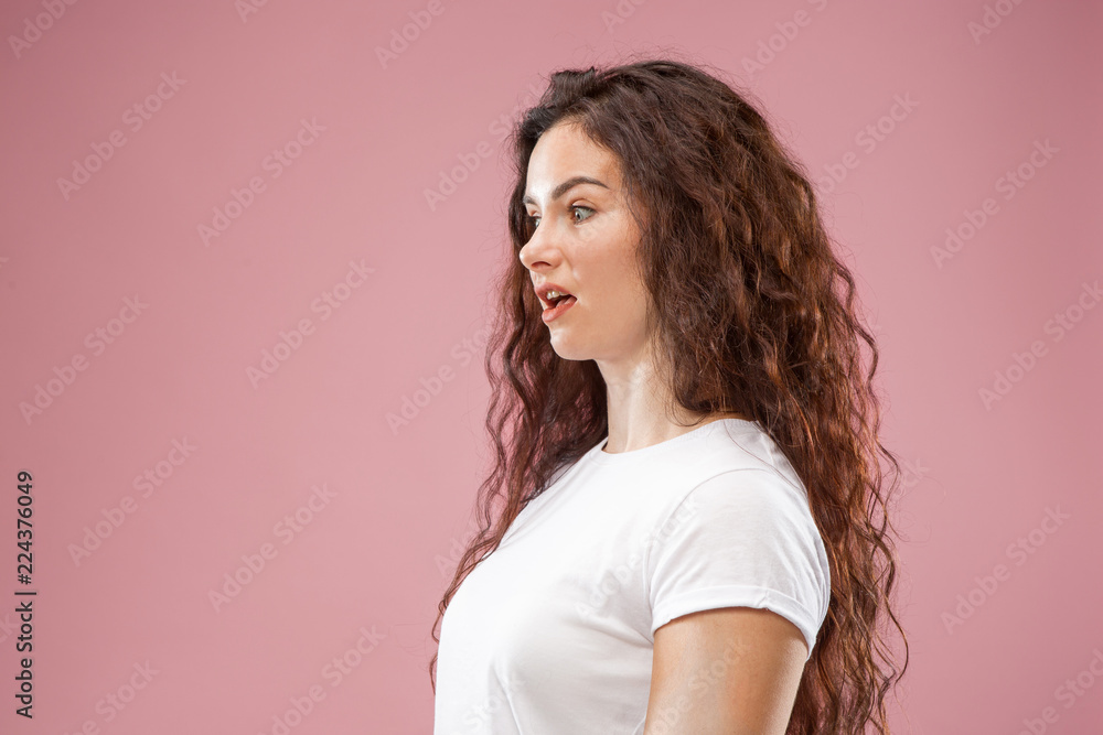 Why is that. Beautiful female half-length portrait isolated on trendy pink studio backgroud. Young emotional frustrated and bewildered woman. Human emotions, facial expression concept. Profile Why is that. Beautiful female half-length portrait isolated on trendy pink studio backgroud. Young emotional frustrated and bewildered woman. Human emotions, facial expression concept. Profile