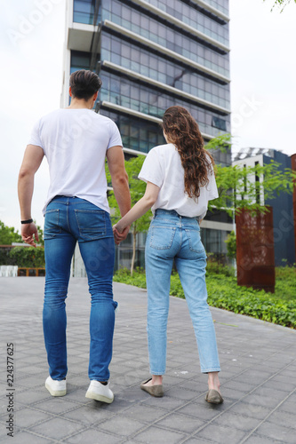 Young beautiful couple posing wearing jeans and t-shirt © 2Design