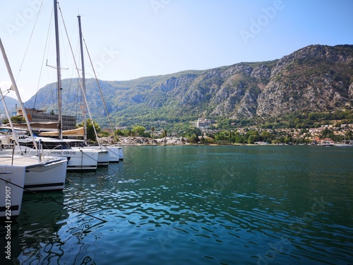 Boats Moored on the Blue Waters of Bay of Kotor Montenegro Europe in front of Mountains