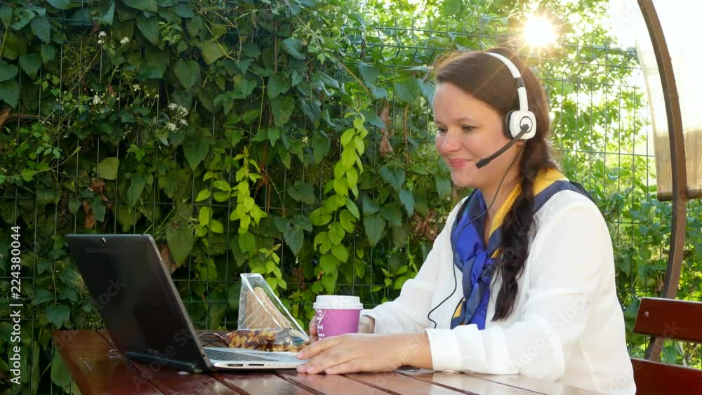 woman talking through internet on laptop outdoors. woman talking through internet on laptop outdoors.