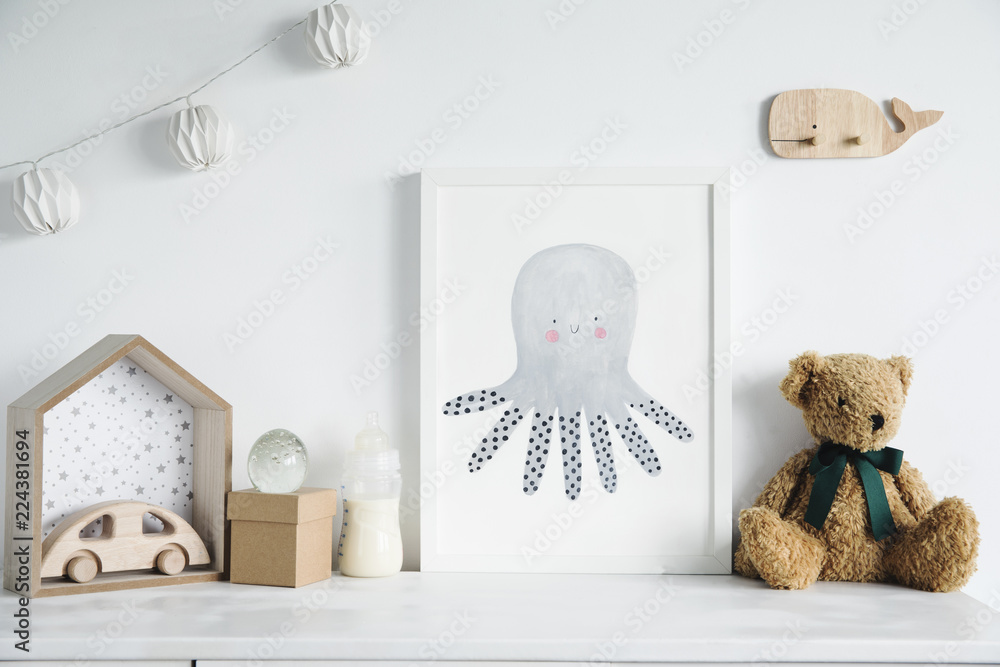 Stylish scandinavian nursery shelf with mock up photo frame, bottle with  milk, teddy bears and wooden toys. Modern interior with white walls and  wooden accessories.. foto de Stock | Adobe Stock