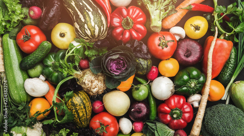 Background of vegetables different fresh farm vegetables. Food or Healthy diet concept  top view and light effects
