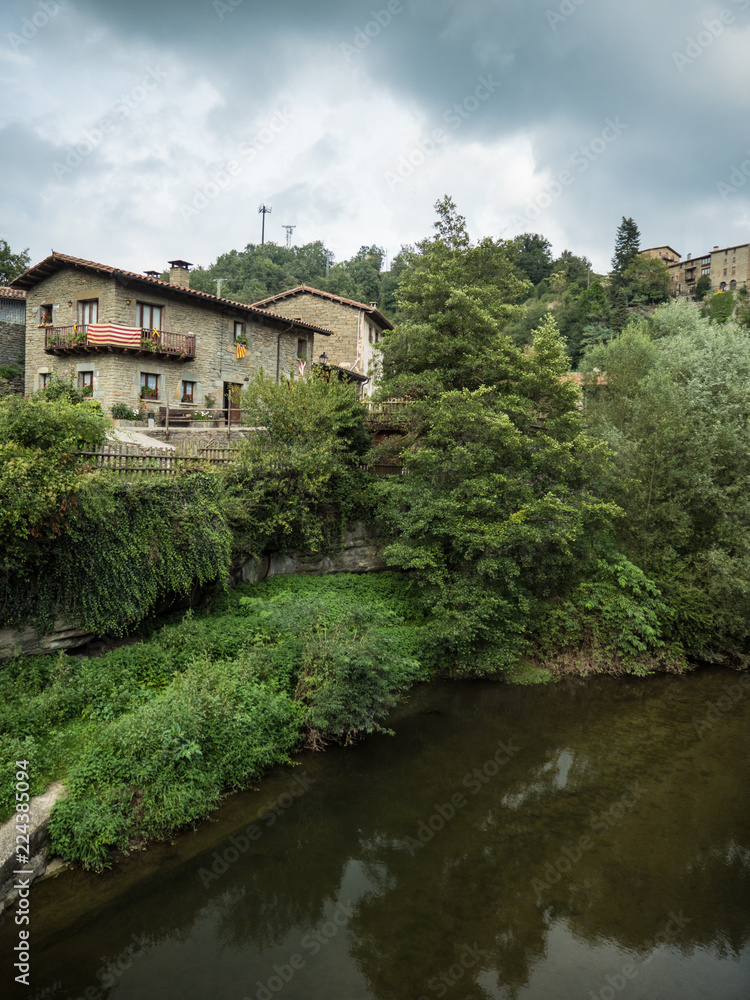 the Rupit river running through the village of Rupit i Pruit in summertime the Rupit river running through the village of Rupit i Pruit in summertime