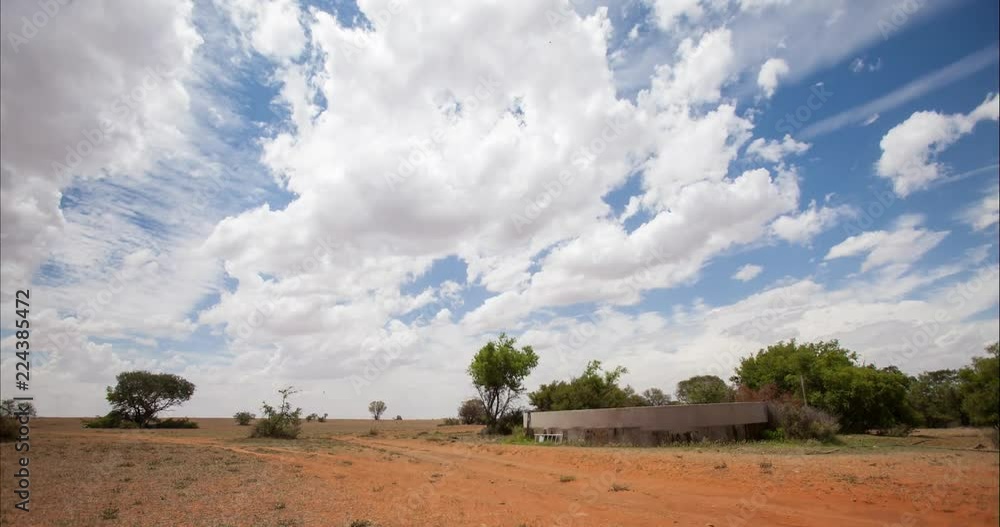 Time-lapse of clouds above flat sandy land Time-lapse of clouds above flat sandy land