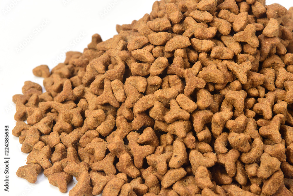 Fototapeta premium a pile of cat food on white background