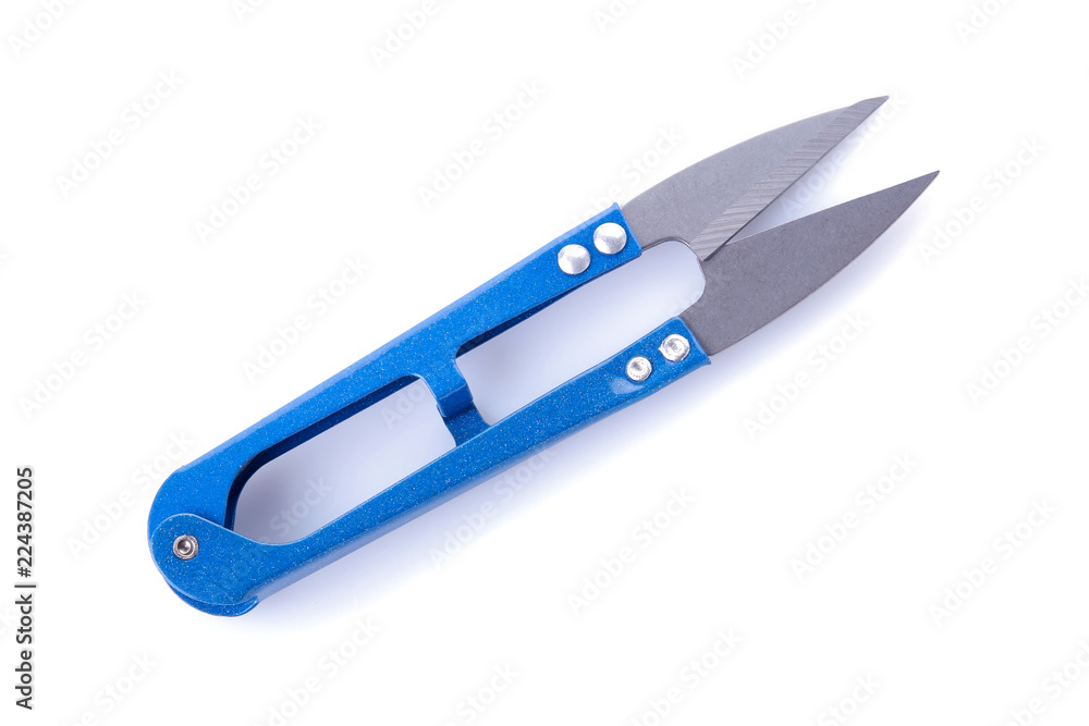 blue scissors for sewing and needlework on a white isolated background. view from above blue scissors for sewing and needlework on a white isolated background. view from above