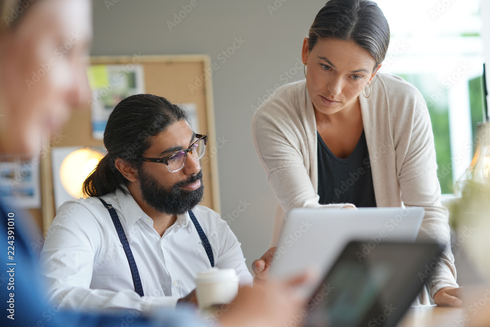 Start-up people working together in office Start-up people working together in office