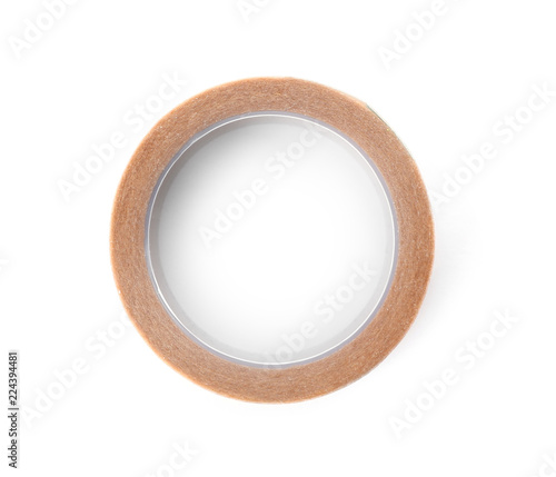 Medical sticking plaster roll on white background, top view