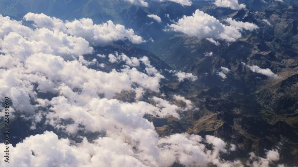 Flying above the clouds and the mountains Flying above the clouds and the mountains