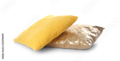 Different colorful pillows on white background