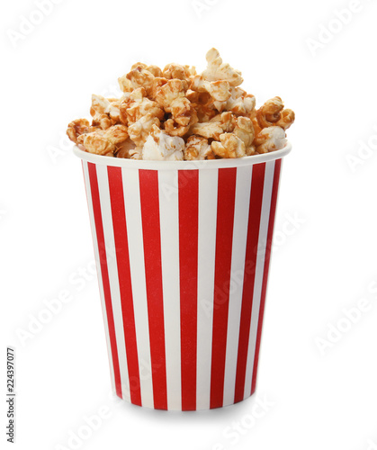 Carton cup with delicious fresh popcorn on white background