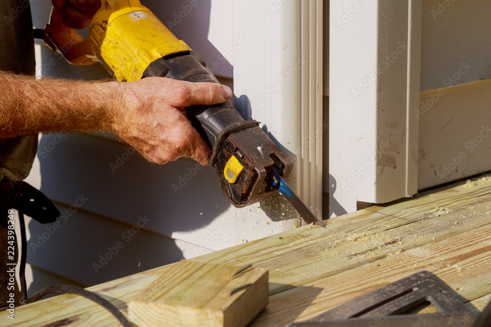 Detail saw cutting piece construction terrace and porch of wood Detail saw cutting piece construction terrace and porch of wood