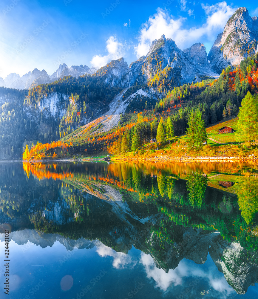 Fototapeta premium autumn scenery with Dachstein mountain summit reflecting in crystal clear Gosausee mountain lake