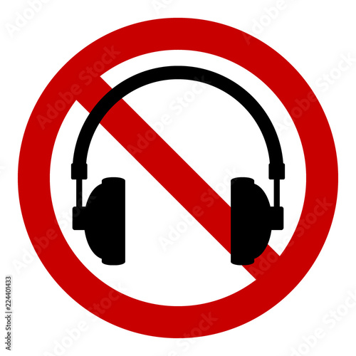 Prohibition sign headphones on white.