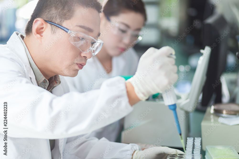 people working at laboratory people working at laboratory