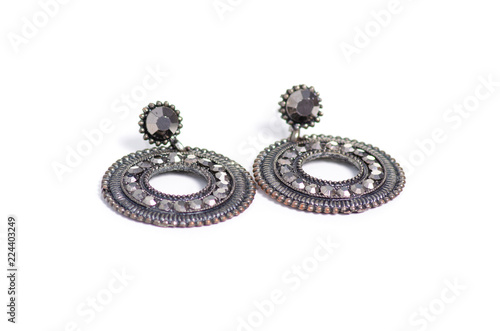 Black earrings stones jewelry bijouterie on a white background isolation