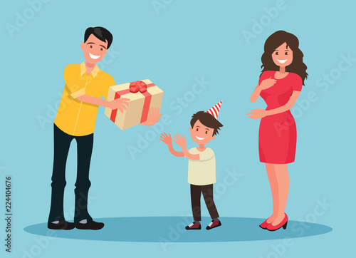 Children s birthday. Parents give her son a present.