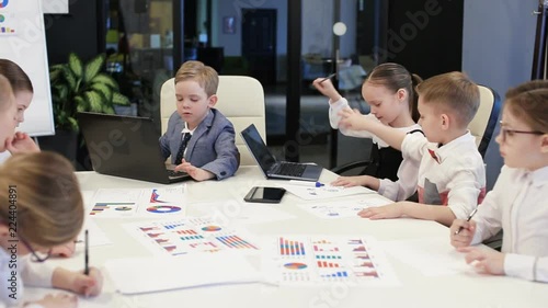 Group Of Children Work In A Modern Office