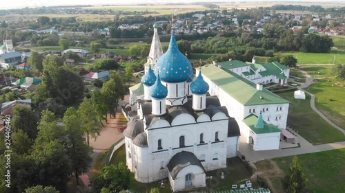 Beautiful panoramic view of Suzdal in summer at sunrise.. Nativity Cathedral of Suzdal Kremlin and river view from above. Suzdal is a famous tourist attraction and part of the Golden Ring of Russia.