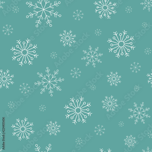 Hand drawn white snowflakes on turquoise background. winter Christmas seamless pattern. New Year backdrop.