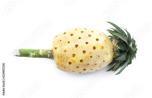 peeled pineapple and fresh ripe pineapple isolated on white background