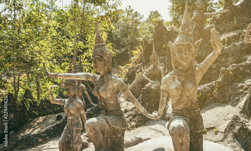 Ancient stone statues in Secret Buddhism Magic Garden, Koh Samui, Thailand. A place for relaxation and meditation. photo