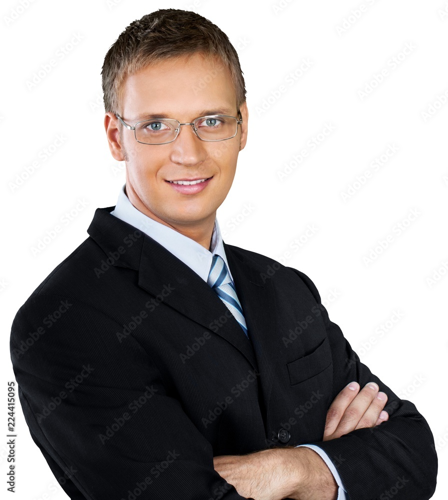 Professional looking man with his arms crossed wearing a suit Professional looking man with his arms crossed wearing a suit