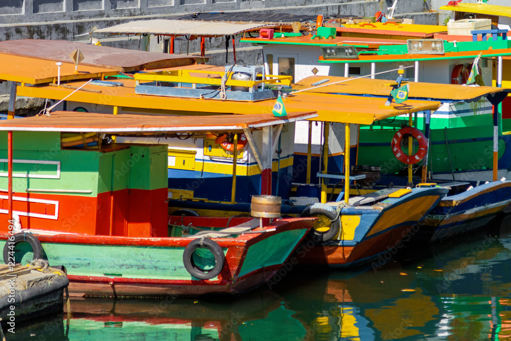 Obraz premium Several colorful and poor boats tied up in the Urca neighborhood (Rio de Janeiro, Brazil)