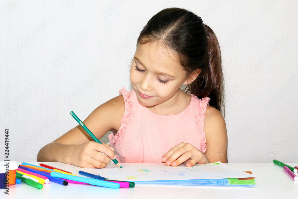little girl draws with colored pencils, child and creativity little girl draws with colored pencils, child and creativity