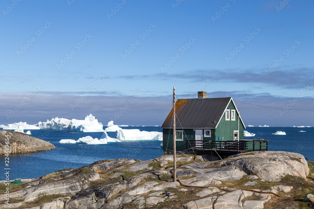 Green house in Qeqertarsuaq, Greenland Green house in Qeqertarsuaq, Greenland
