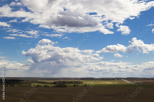 Rural landscape with cumulus clouds © yauhenka