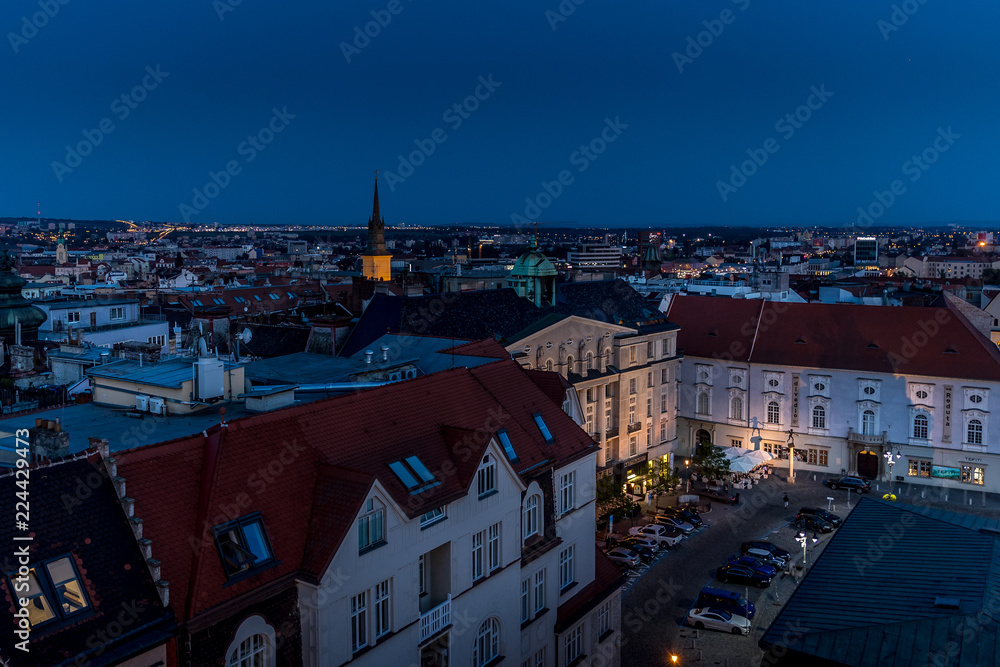 Fototapeta premium Brno and one of its big square called Zelny market during season you can buy many vegetables and fruits captured during sunset with city light