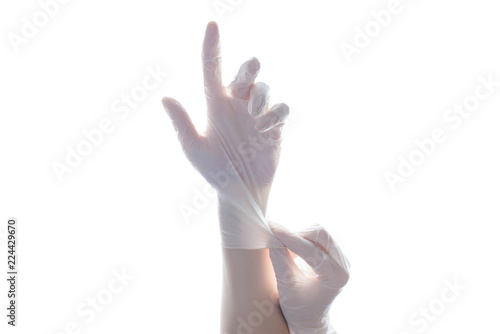 Experiment science people point show up concept. Close up photo of professional experienced doctor putting on white sterile rubber gloves isolated on white background copyspace empty blank place