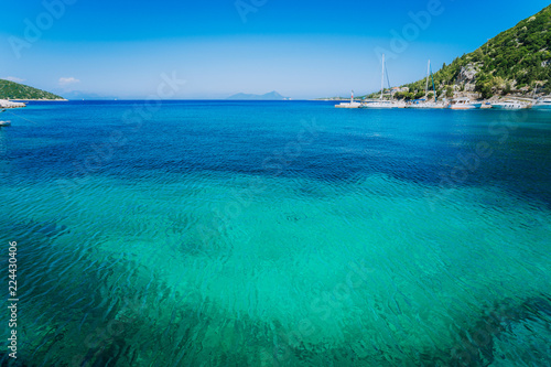 Azure clear water. Picturesque scenery of the bay with turquoise calm water  surrounded by cliffs