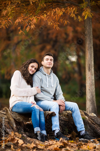 Autumn photo of a beautiful young couple