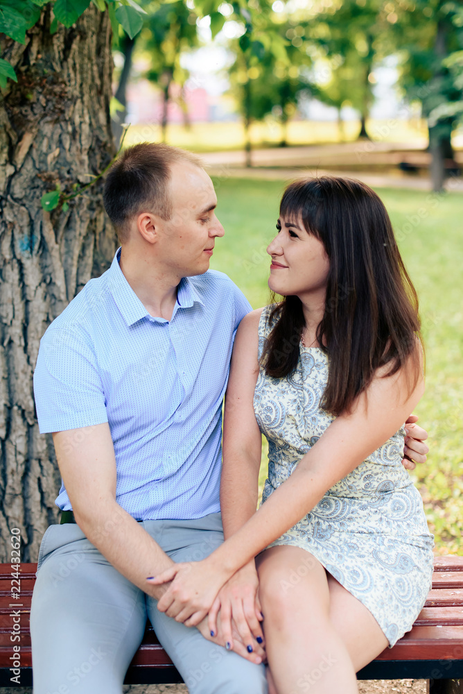 young loving couple walking in the park outdoors young loving couple walking in the park outdoors
