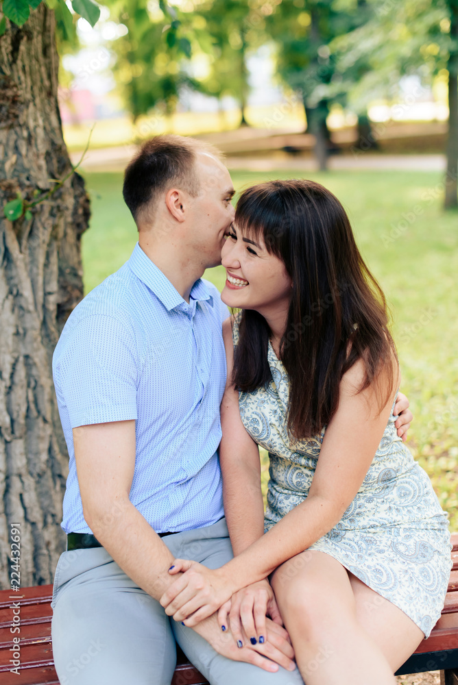 young loving couple walking in the park outdoors young loving couple walking in the park outdoors
