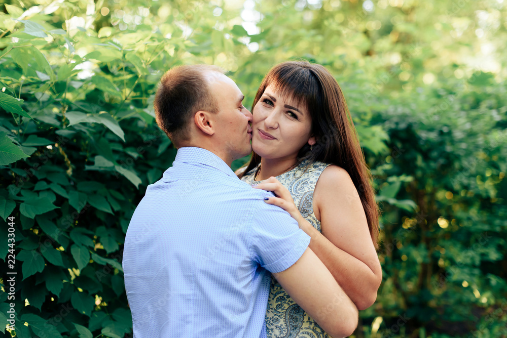 Fototapeta premium young loving couple walking in the park outdoors