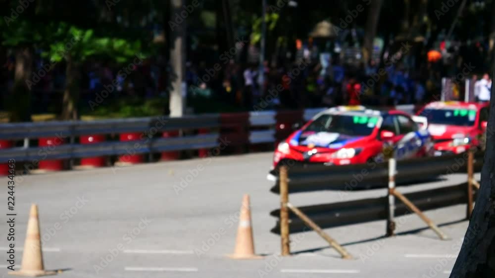blurred image of racing sedan car blurred image of racing sedan car