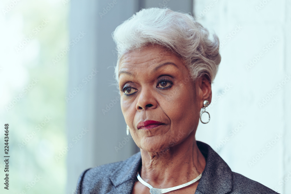 Portrait of thoughtful senior businesswoman Portrait of thoughtful senior businesswoman