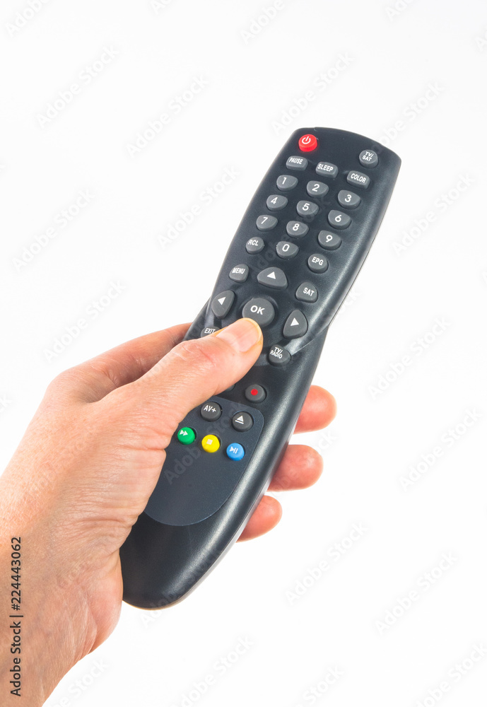 hand holding a remote control, close up hand holding a remote control, close up