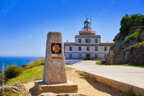 Saint James Way sign and lighthouse of Finisterre photo