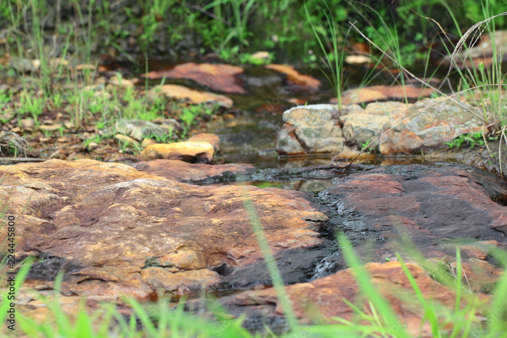 Small stream on the rocky plain in tropical forest,Thailand Small stream on the rocky plain in tropical forest,Thailand