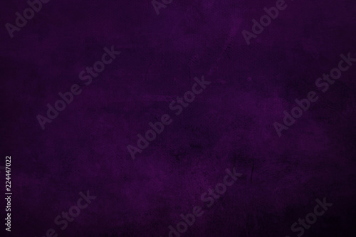 DArk purple grungy canvas background or texture with dark vignette borders