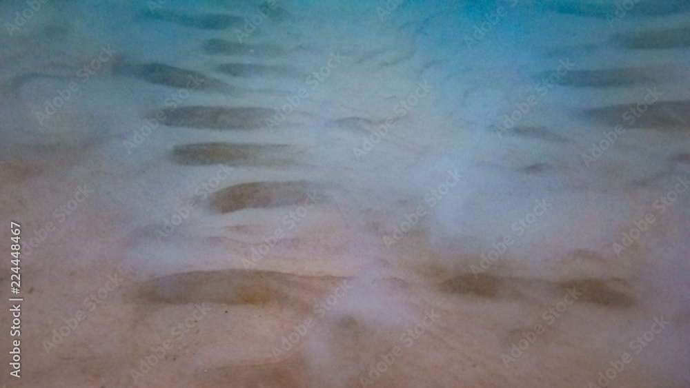 Looking at the Sands of the Shallow Ocean Floor in Phuket Thailand