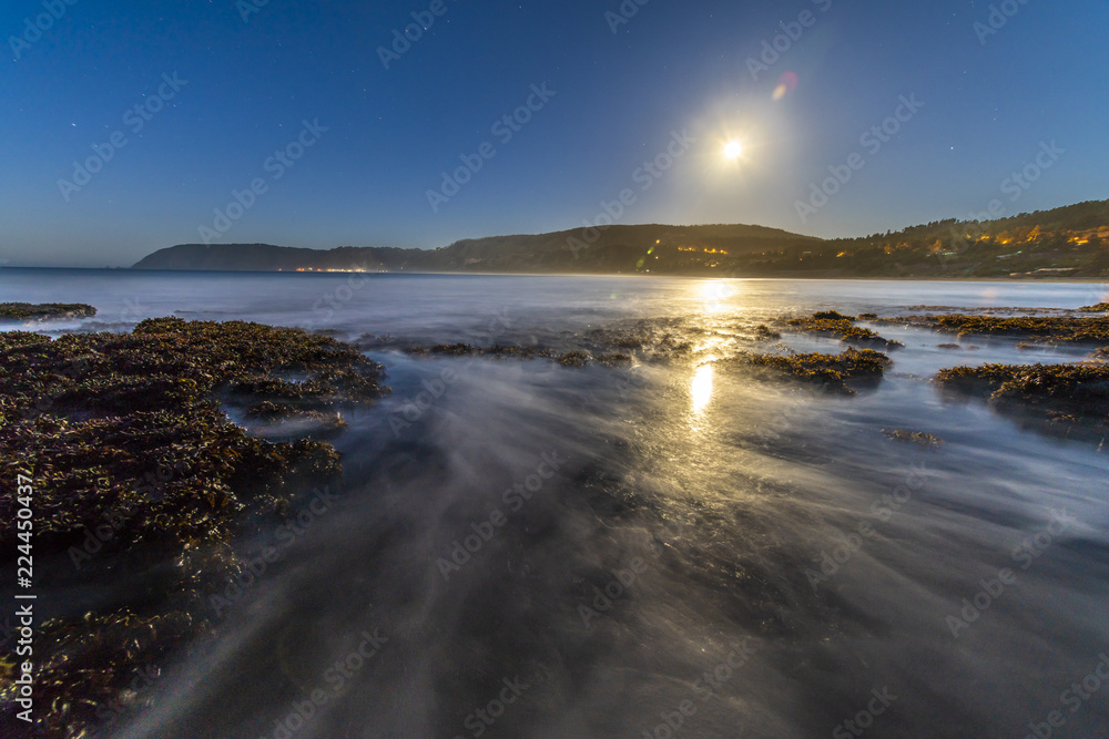 Fototapeta premium A full moon illuminated landscape at Puertecillo Beach close to Santiago de Chile an amazing place for surf and enjoy at the beach, Chile