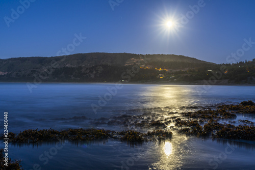 A full moon illuminated landscape at Puertecillo Beach close to Santiago de Chile an amazing place for surf and enjoy at the beach  Chile