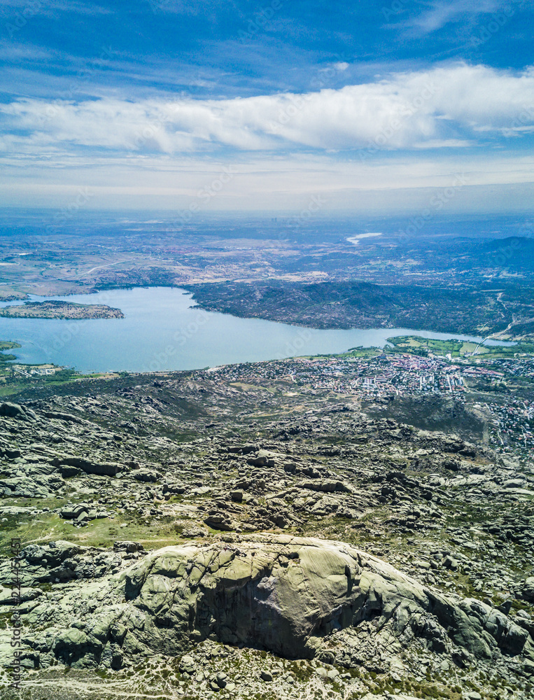An aerial view over el Yelmo summit and Santillana dam lake at 