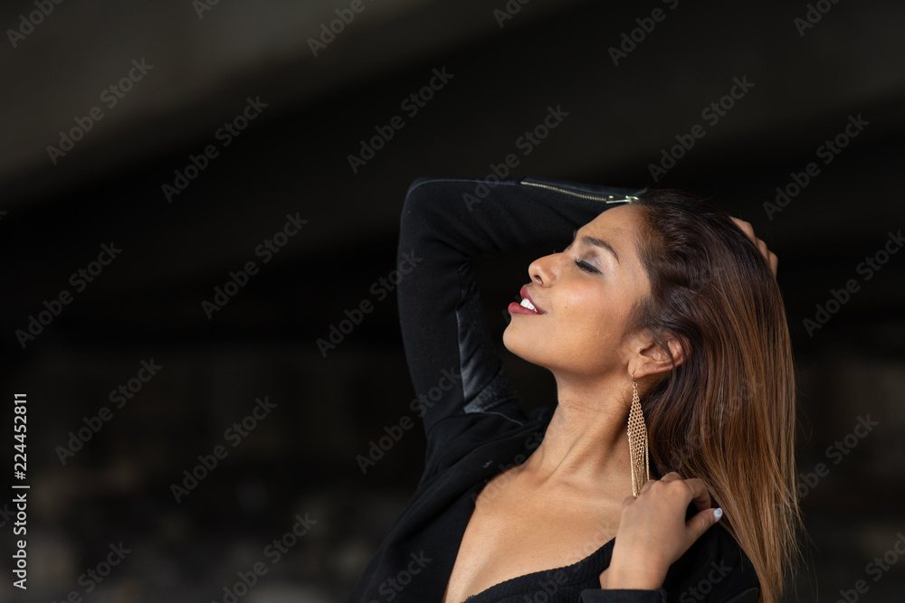 Young woman in profile enjoying the moment Young woman in profile enjoying the moment